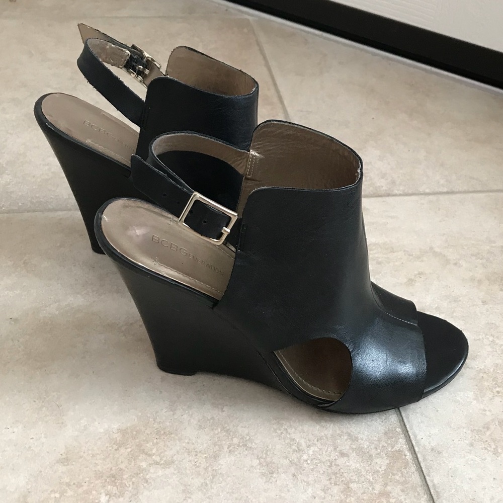 Black leather peep-toe wedges